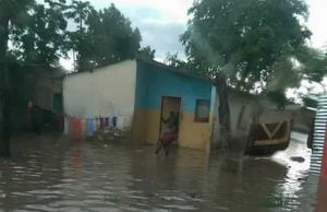 House in Lusaka's Misisi Compound almost submerged in water leaving occupants stranded.