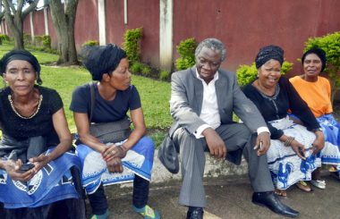 Peoples Party president Mike Mulongoti with MMD women at Regina's funeral in Kabulonga-Picture by Tenson Mkhala