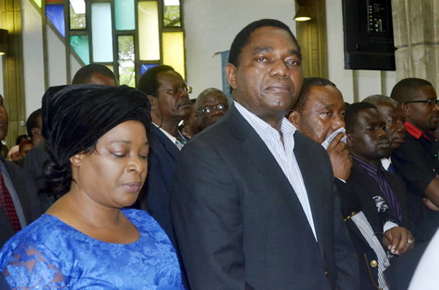 UPND leader Hakainde Hichilema, wife Mutinta and his deputy Geoffrey Bwalya Mwamba at Regina's requiem mass in Lusaka-picture by Tenson Mkhala