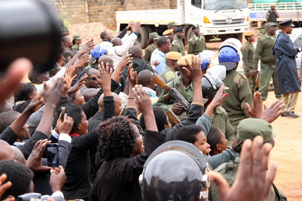 UPND supporters wave at their leader Hakainde Hichilema as he was taken back to Lusaka Central Prison-Picture by Tenson Mkhala