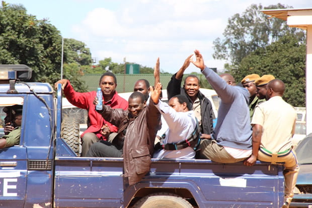UPND leader Hakainde Hichilema with his co accused being taken back into detention-picture by Tenson Mkhala