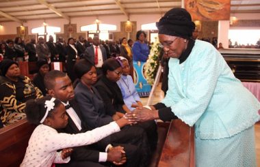 Vice president Inonge Wina greets late Health permanent secretary John Moyo's daughter Edina during requrim mass at the Cathedral of the Child Jesus Catholic Church in Lusaka picture by Tenson MkhalaVice president Inonge Wina greets late Health permanent secretary John Moyo's daughter Edina during requrim mass at the Cathedral of the Child Jesus Catholic Church in Lusaka picture by Tenson Mkhala