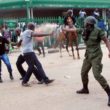 Police officer teargas a UPND cadre in Lusaka