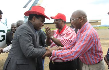 UPND Leader Hakainde Hichilema greets Robert Sichinga as his vice Geoffery Mwamba looks on in Chipata picture by Tenson Mkhala