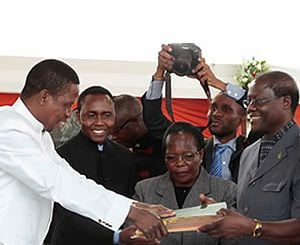 President Edgar Lungu recieves an Amended Constitution from former Justice minister Ngosa Simbyakula at Heroes Stadium in Lusaka-picture by Tenson Mkhala