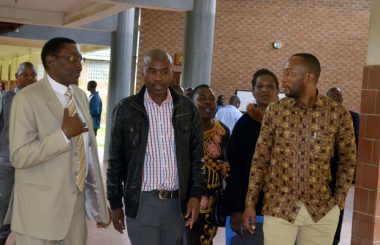Mark Mubalama (r) with his relatives at Lusaka's Magistrates Court -February 27, 2017-Picture by Tenson Mkhala
