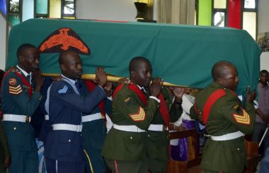 Pole bearers carrying Regina's casket at Cathedral of the Holy Cross in Lusaka-picture by Tenson Mkhala