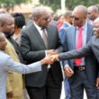 Home Affairs minister Stephen Kampyongo greets deputy minister in the office of the vice president Lawrence Sichalwe as Health minister Dr Chitalu Chilufya and Housing and infrastructure minister Ronald Chitotela during Youth Day celebrations in Lusaka-picture by Tenson Mkhala