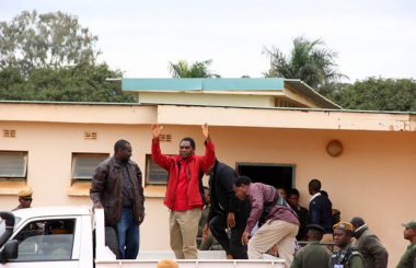 UPND leader Hakainde Hichiilema waves at supporters as he was taken back to Lusaka Central Prison-picture by Tenson Mkhala