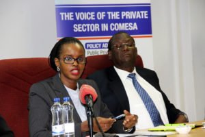 COMESA assistant secretary general Ambassador Dr Kipyego Cheluget with COMESA Business Council chief executive officer Sandra Uwera at a press briefing-picture by Tenson Mkhala