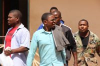 Chilufya Tayali being taken to Woodlands police cells from Lusaka's Magistrate Court-picture by Tenson Mkhala