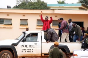UPND leader Hakainde Hichiilema waves at supporters as he was taken back to Lusaka Central Prison-picture by Tenson Mkhala