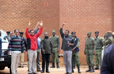 UPND laeder HH waves at his supporter at Court-Picture By Tenson Mkhala