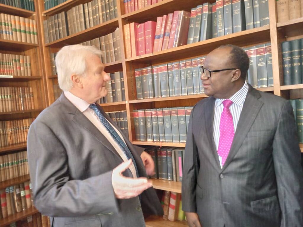 Chief Justice of England and Wales Lord Burnett of Maldon and Deputy Chief Justice Michael Musonda in the Supreme Court Library during a tour of the facility