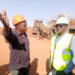 Minister of Green Economy and Environment Collins Nzovu listening to OreZone Mining Limited Manager Vusa Moyo when he toured the mine – Picture by Philip Chisalu