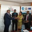 Ministry of Commerce, Trade and Industry Permanent Secretary Lillian Bwalya hands over equipment procured under the COMESA Trade Facilitation Programme: Zambia Border Post Upgrade Project to RTSA and the Department of Immigration