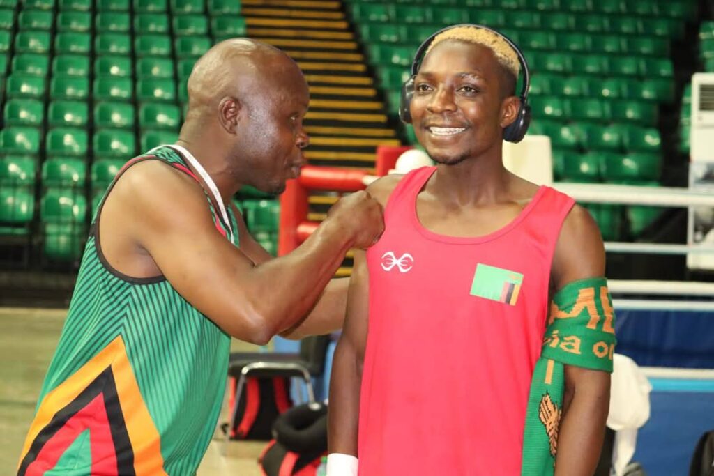 File picture: National Boxing Team coach Wisdom Mudenda giving tips to boxer Patrick Chinyemba.