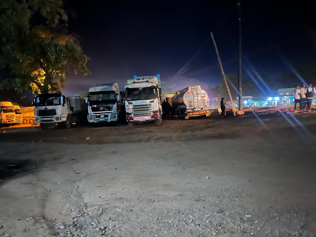 Cross border trucks packed for the night in Chirundu
