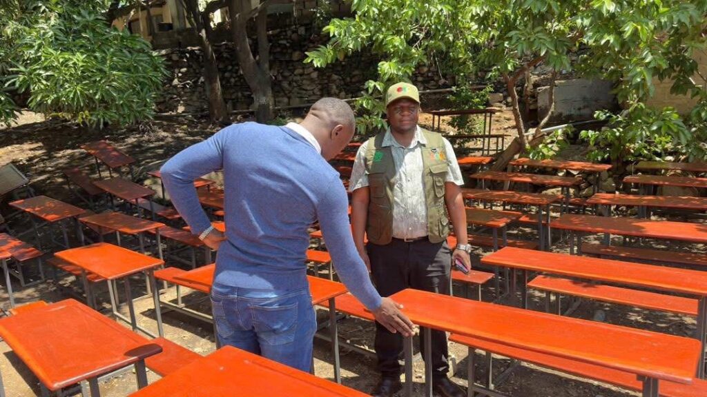 Siavonga Council Secretary Kennedy Shombo inspects contractors engaged under the 2025 CDF allocation to manufacture school desks in the district.